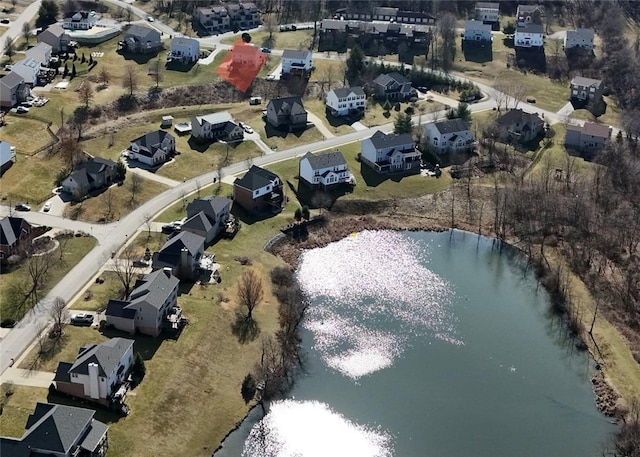 birds eye view of property featuring a residential view and a water view