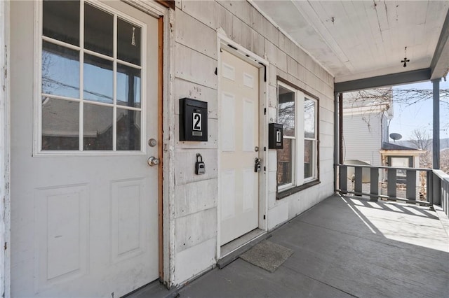 entrance to property featuring a porch