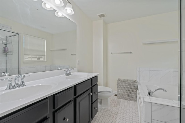 full bathroom featuring a sink, visible vents, a garden tub, and double vanity