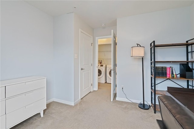 bedroom featuring washer and clothes dryer, carpet flooring, and baseboards