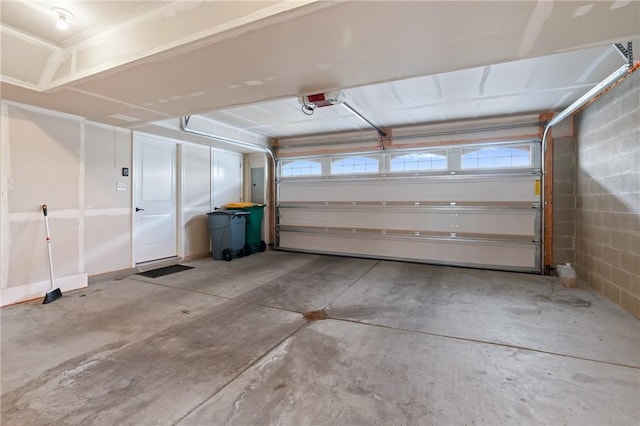 garage with concrete block wall