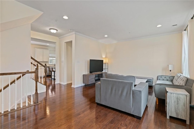 living area featuring baseboards, stairs, ornamental molding, recessed lighting, and wood finished floors