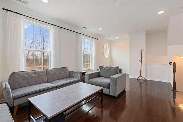 living area featuring recessed lighting, visible vents, ornamental molding, and dark wood-style flooring