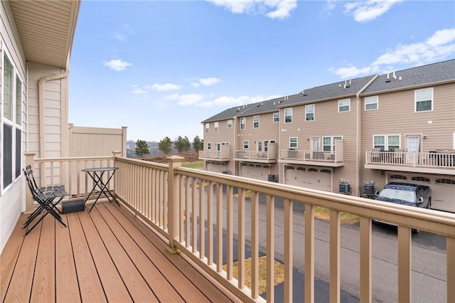 balcony with central AC unit and a residential view