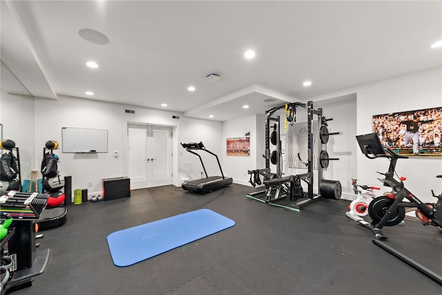 exercise room with recessed lighting, visible vents, and baseboards