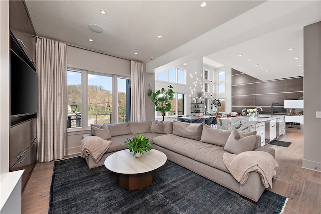 living area with recessed lighting and light wood-type flooring