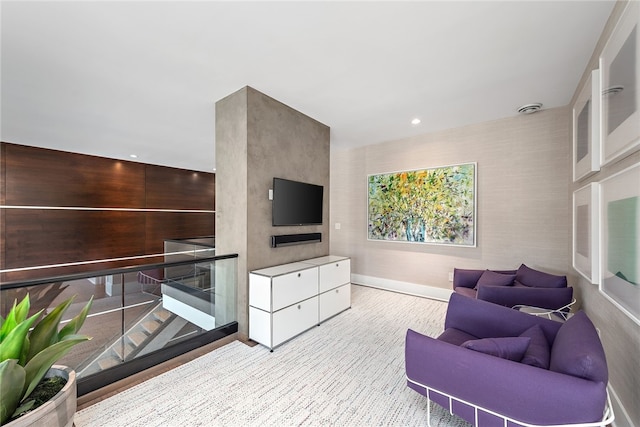 living area with recessed lighting and baseboards