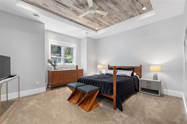 bedroom featuring visible vents, a raised ceiling, wooden ceiling, baseboards, and light colored carpet