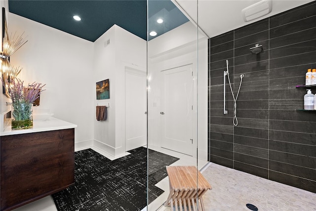 bathroom featuring visible vents, recessed lighting, tile patterned flooring, walk in shower, and vanity