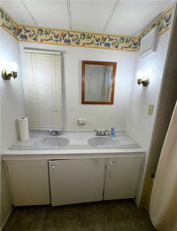 bathroom with double vanity and a sink