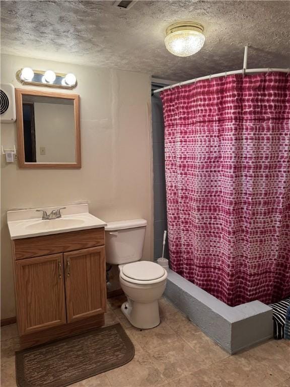 bathroom with a shower with curtain, a textured ceiling, vanity, and toilet