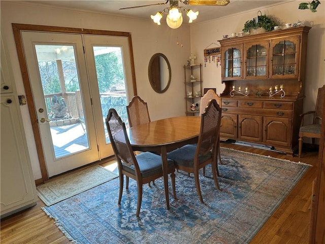 dining room featuring a ceiling fan and light wood-style floors