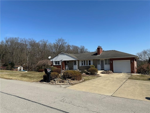 ranch-style home with driveway, a chimney, a front lawn, a garage, and brick siding