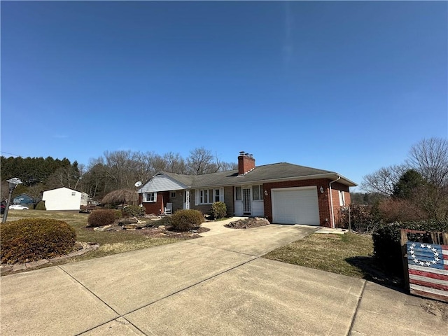 ranch-style house with a garage, brick siding, concrete driveway, and a chimney