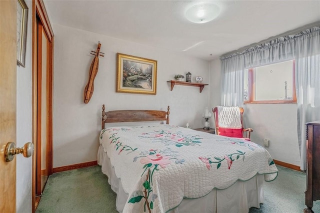 carpeted bedroom featuring baseboards