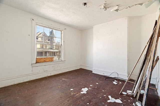 spare room featuring a textured ceiling