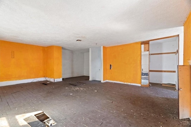 spare room with a textured ceiling