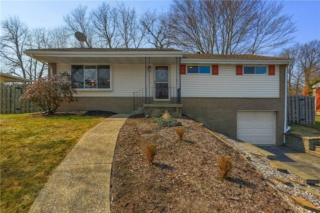 ranch-style home with brick siding, a front yard, a garage, and fence