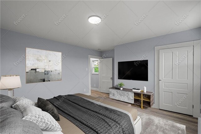 bedroom featuring wood finished floors