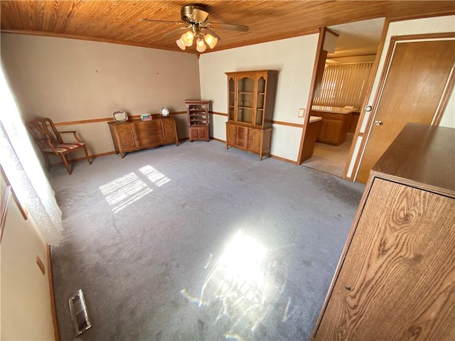 unfurnished bedroom featuring ceiling fan, light carpet, and wooden ceiling