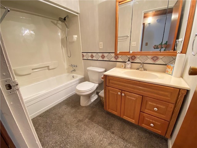 bathroom featuring vanity, toilet, tile walls, and  shower combination