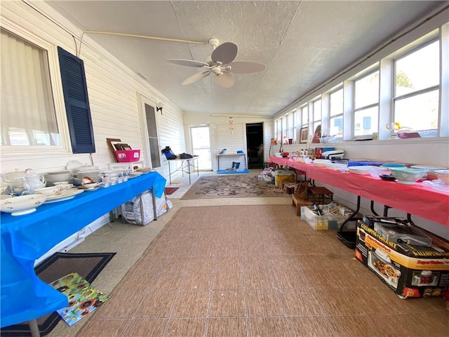 sunroom / solarium with ceiling fan