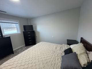 carpeted bedroom with baseboards