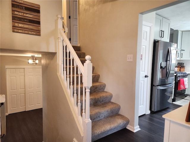 stairs with wood finished floors