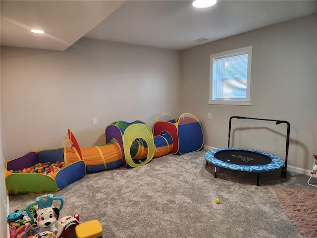 recreation room featuring recessed lighting, baseboards, visible vents, and carpet floors