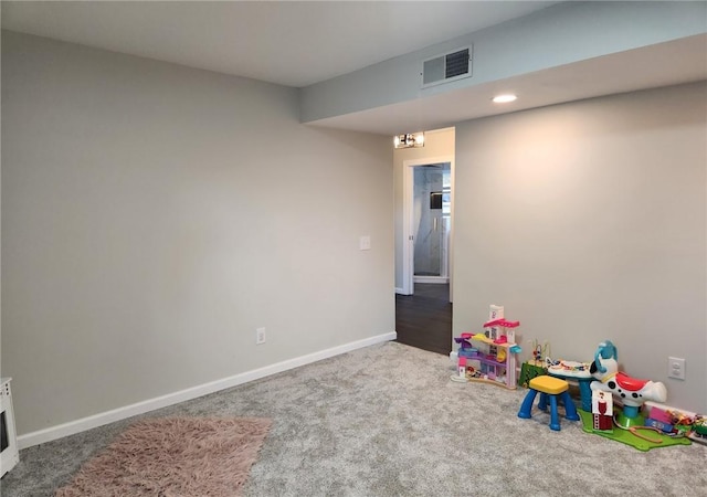 recreation room with visible vents, baseboards, and carpet