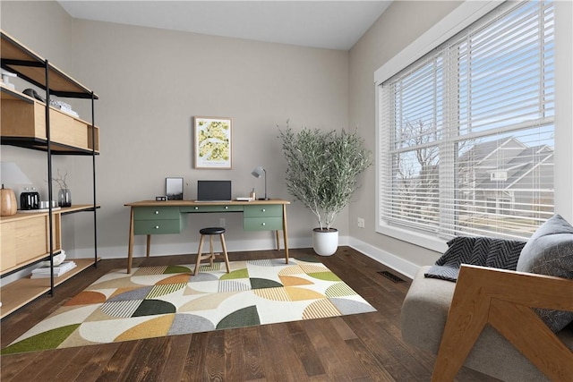 office area with baseboards and wood finished floors