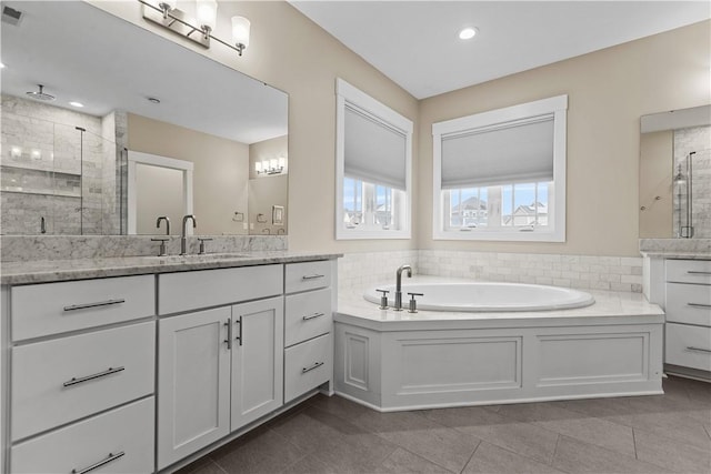 bathroom featuring vanity, visible vents, a stall shower, tile patterned floors, and a bath