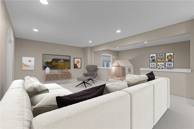 living room featuring carpet flooring, recessed lighting, and baseboards