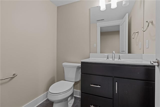 bathroom with visible vents, toilet, tile patterned flooring, baseboards, and vanity