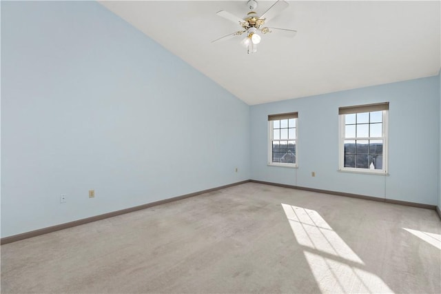 empty room with baseboards, ceiling fan, and carpet flooring