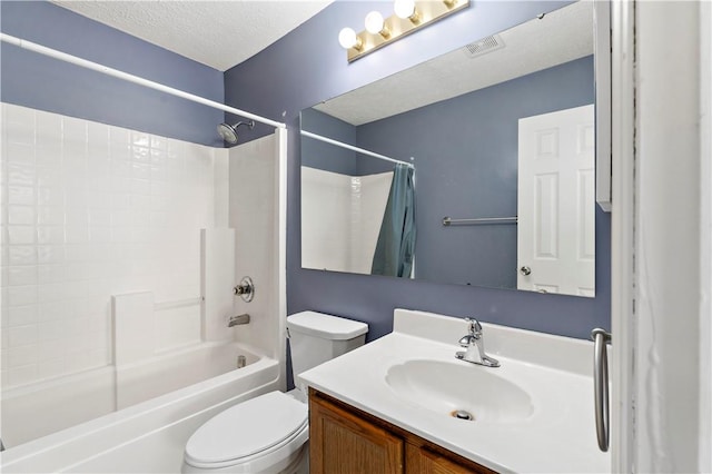 full bath featuring vanity, visible vents, a textured ceiling, shower / bathing tub combination, and toilet