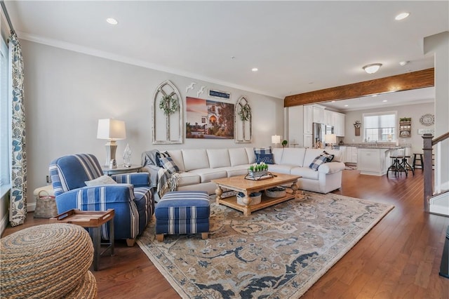 living room featuring stairs, recessed lighting, dark wood-style floors, and ornamental molding