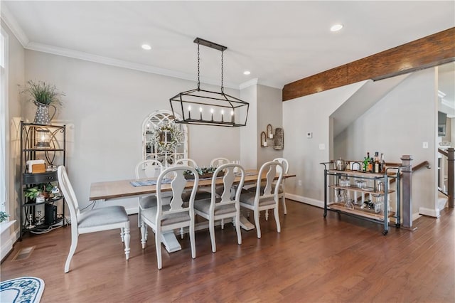 dining room with crown molding, recessed lighting, wood finished floors, and baseboards