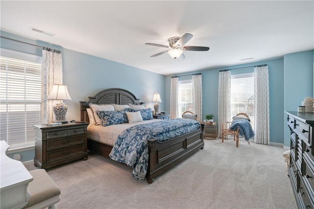 bedroom with visible vents, carpet flooring, baseboards, and a ceiling fan