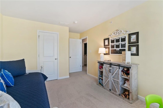 sitting room featuring carpet flooring and baseboards