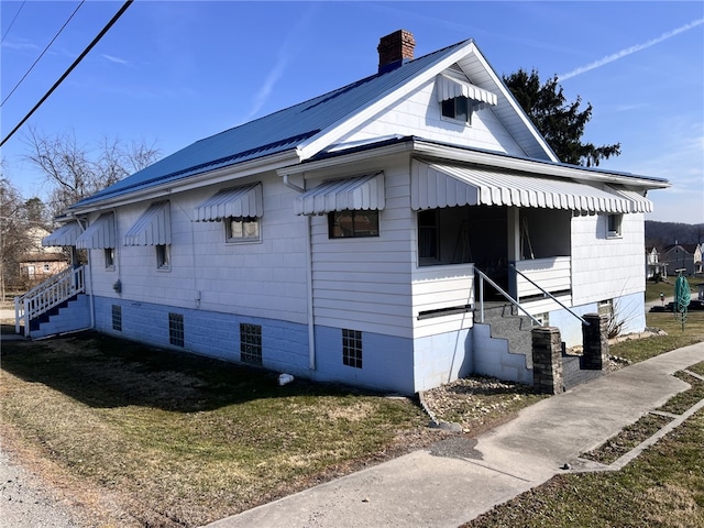 view of side of home with a chimney