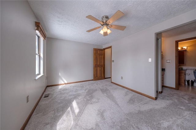 unfurnished bedroom with light carpet and baseboards