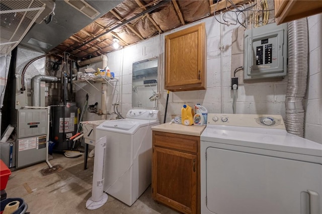 laundry room featuring washer and clothes dryer, electric panel, a sink, gas water heater, and cabinet space