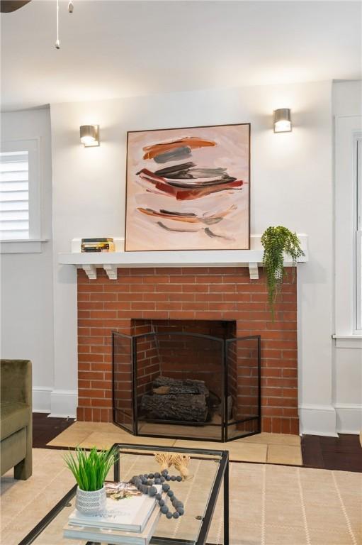 room details with baseboards and a fireplace with flush hearth