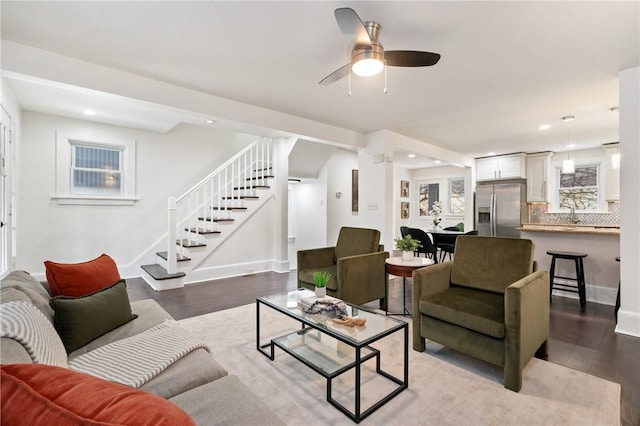 living area with baseboards, stairway, recessed lighting, dark wood-style floors, and a ceiling fan