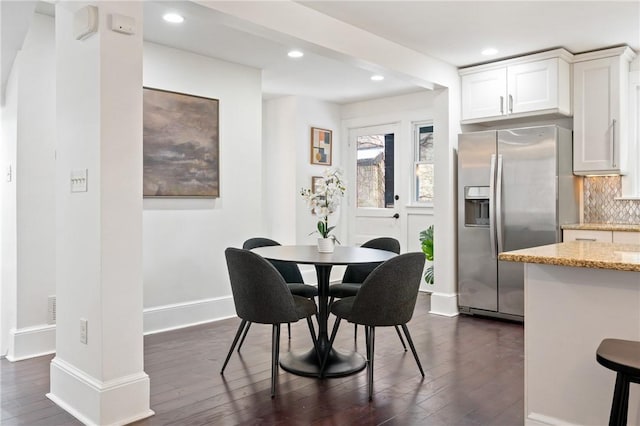 dining room with recessed lighting, dark wood-style floors, and baseboards