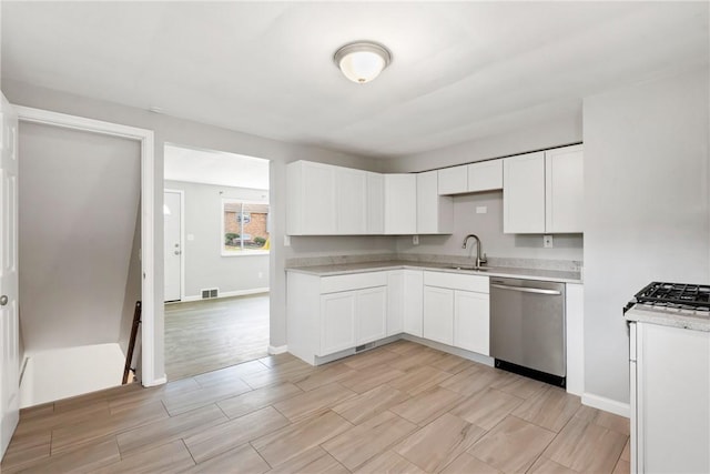 kitchen with dishwasher, light countertops, visible vents, and white cabinetry