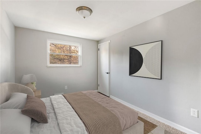 bedroom with carpet and baseboards