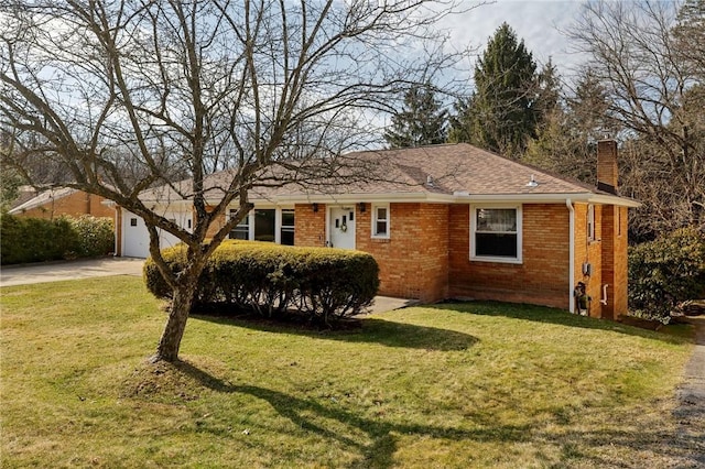 single story home featuring brick siding, an attached garage, concrete driveway, and a front lawn