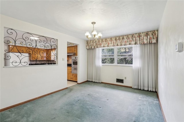 spare room with visible vents, light colored carpet, baseboards, and an inviting chandelier